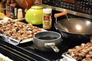 chicken ready for the oven and sauce simmering away_small