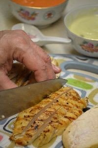 slicing the chicken into long strips_small