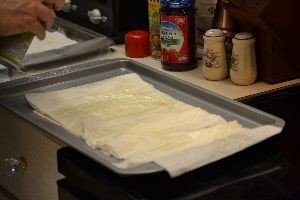 spray layers of filo dough with olive oil_small