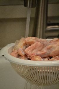 wash chicken under running water_small