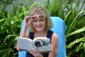 Julie Reading backyard ferns