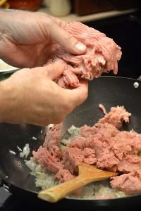 adding the ground turkey to the wok to brown_small