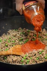 adding the marinara sauce to the timbale base_small