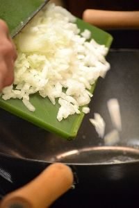 adding the onion to the wok_small