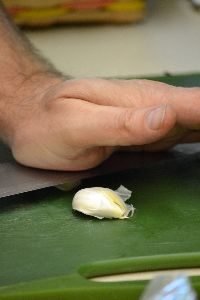 crushing the garlic for slicing_small