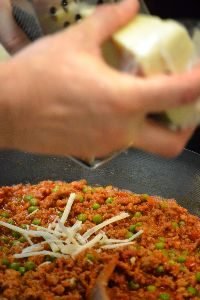 grating the timbale cheeses_small
