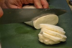 slicing the mozzarella into chunks_small