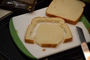 trying to cut an oval shape out of a slice of bread_small
