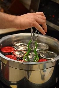 removing the jars with the corn from the water_small