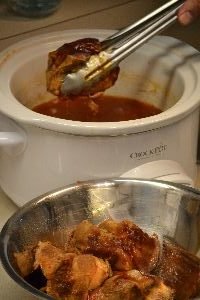 removing the pork butt from the crock pot_small