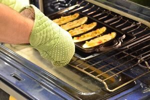 Gordon placing them into the oven_small