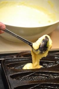 ladeling the corn bread mixture_small
