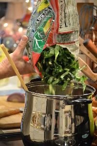 13 adding the collard greens to the liquid_small