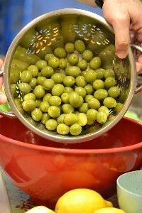 13 adding the olives to a large bowl_small