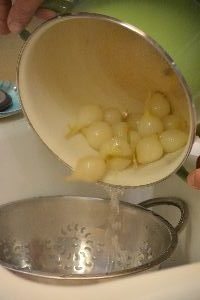 21 draining the pearl onions into the sink_small